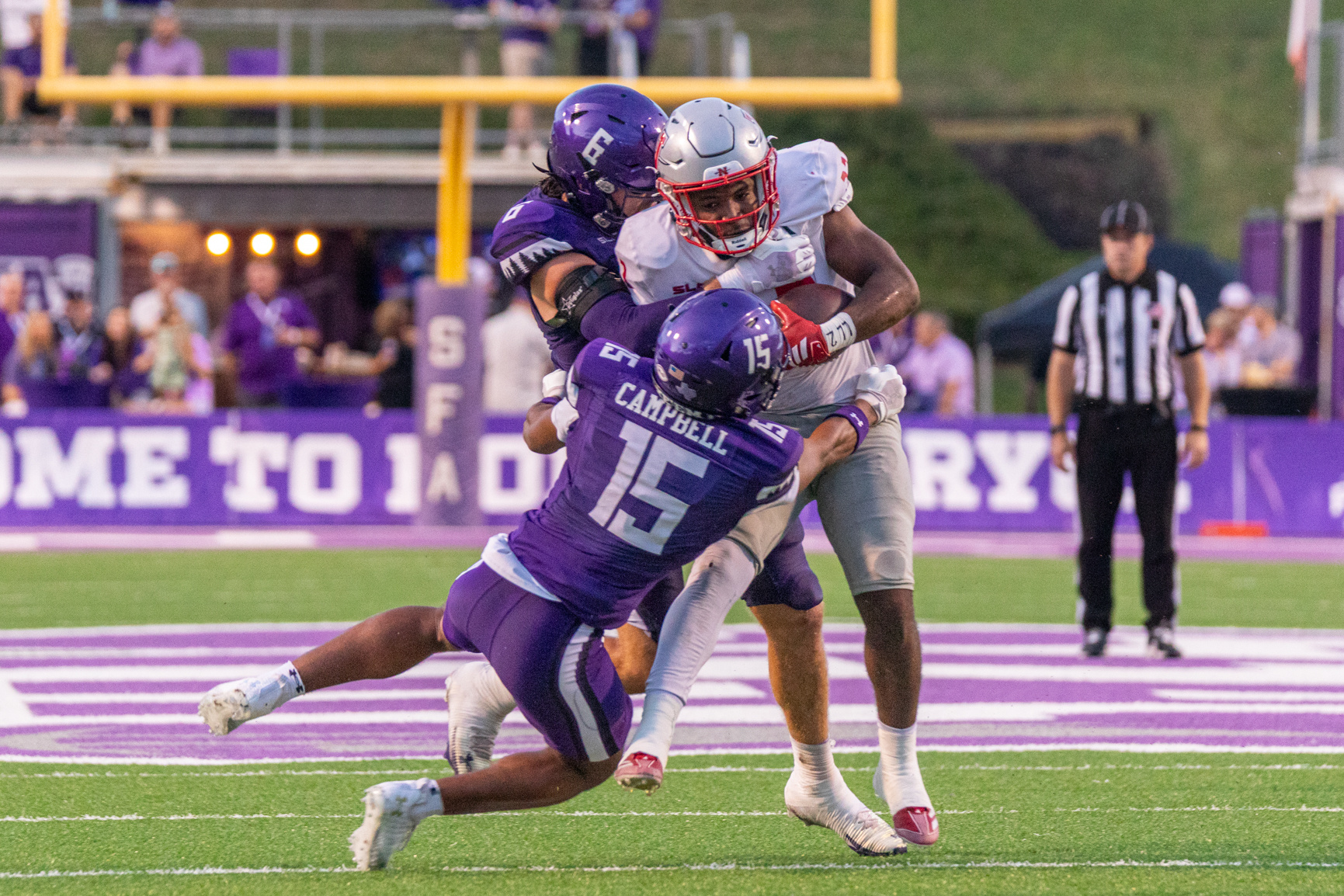 SFA redshirt-senior safety Rayden Campbell and SFA senior linebacker Jaydon Southard bring down Nicholls sophomore running back Miequle Brock Jr. Series produced for Stephen F. Austin State University marketing material and social media, 2025.