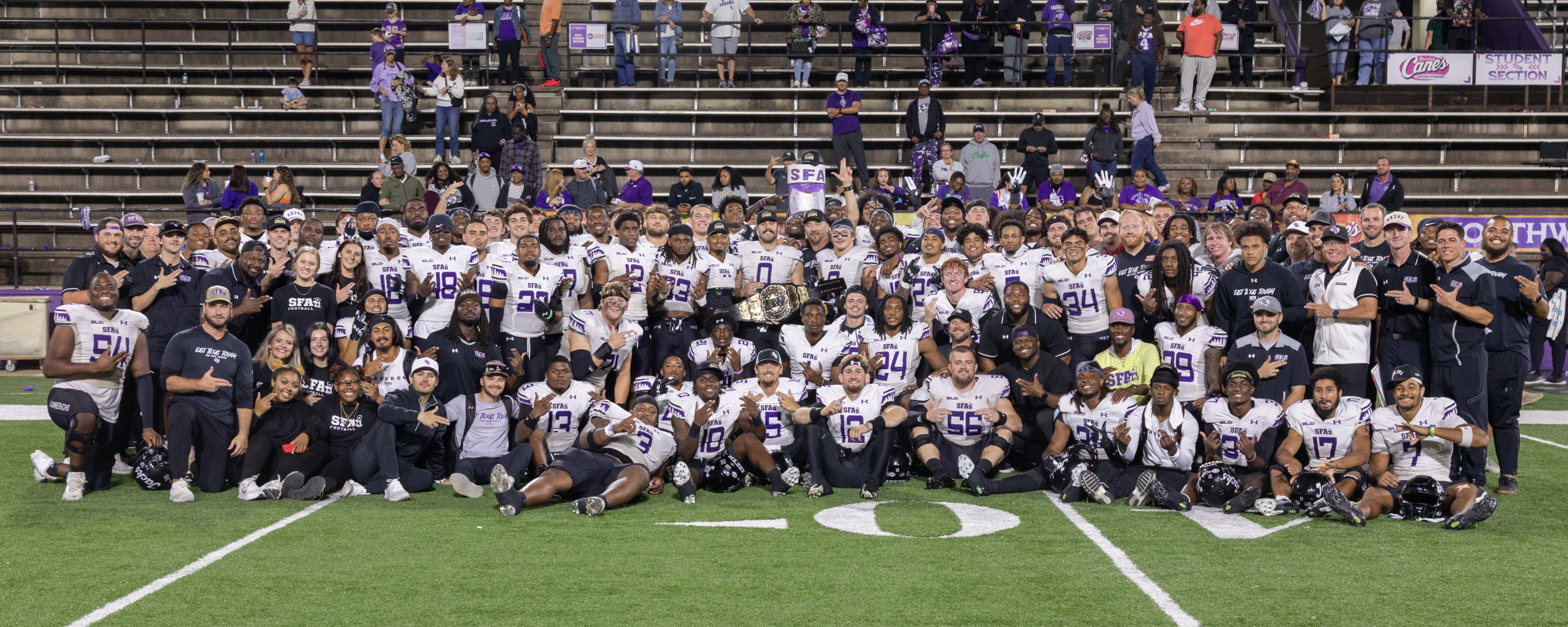 The SFA Football team poses for a picture after beating Northwestern State University 62-14. This game marked SFA's 10th consecutive win, making them unbeaten in the Southland Conference regular season.