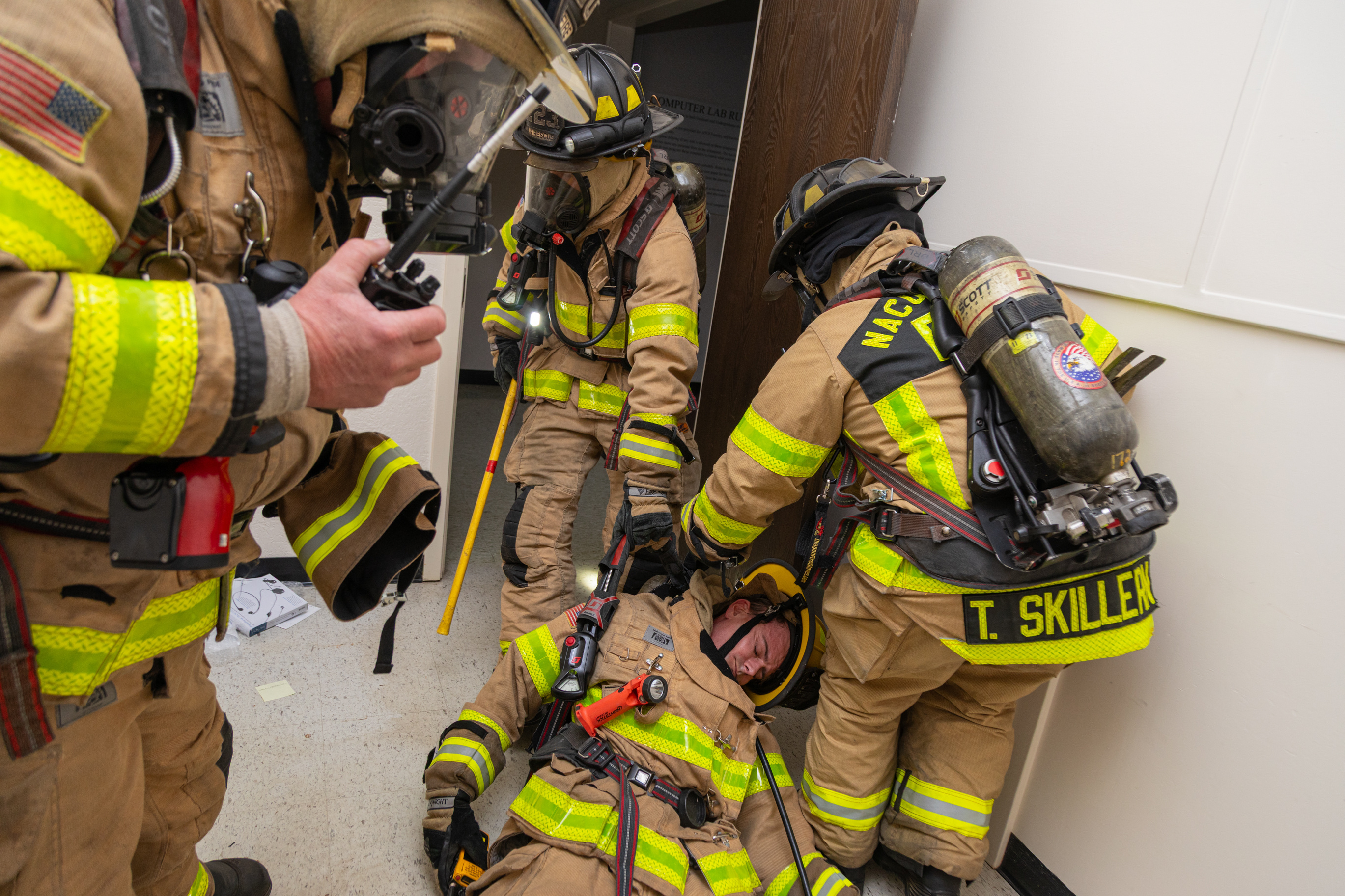 Firefighters from The City of Nacogdoches drag out a firefighter during a training exercise held in the SFA Arthur Temple College of Forestry and Agriculture.